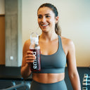 Woman holding EMBA bottle