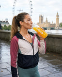 Woman drinking tropical electrolytes from an EMBA bottle